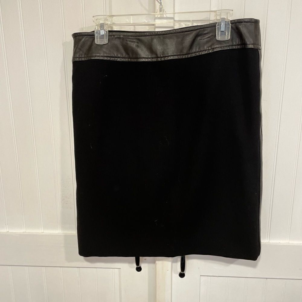 INC: Black skirt with black leather accents on waist/sides 100% wool size 10